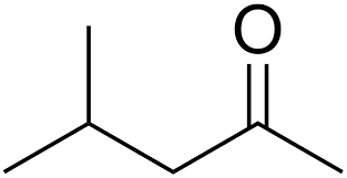 Methyl Isobutyl Ketone (MIBK) dalam botol kaca di atas meja laboratorium